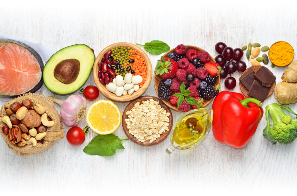 selection of nutrient-rich foods including fruits, vegetables, nuts, seeds, and whole grains