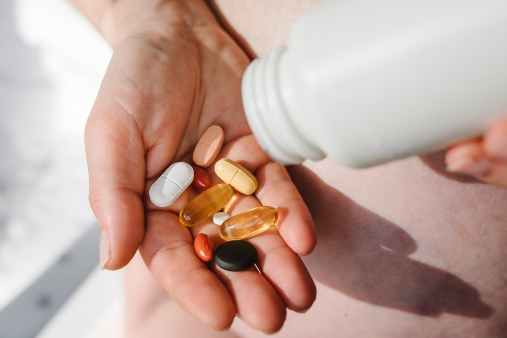 handful of vitamin supplements